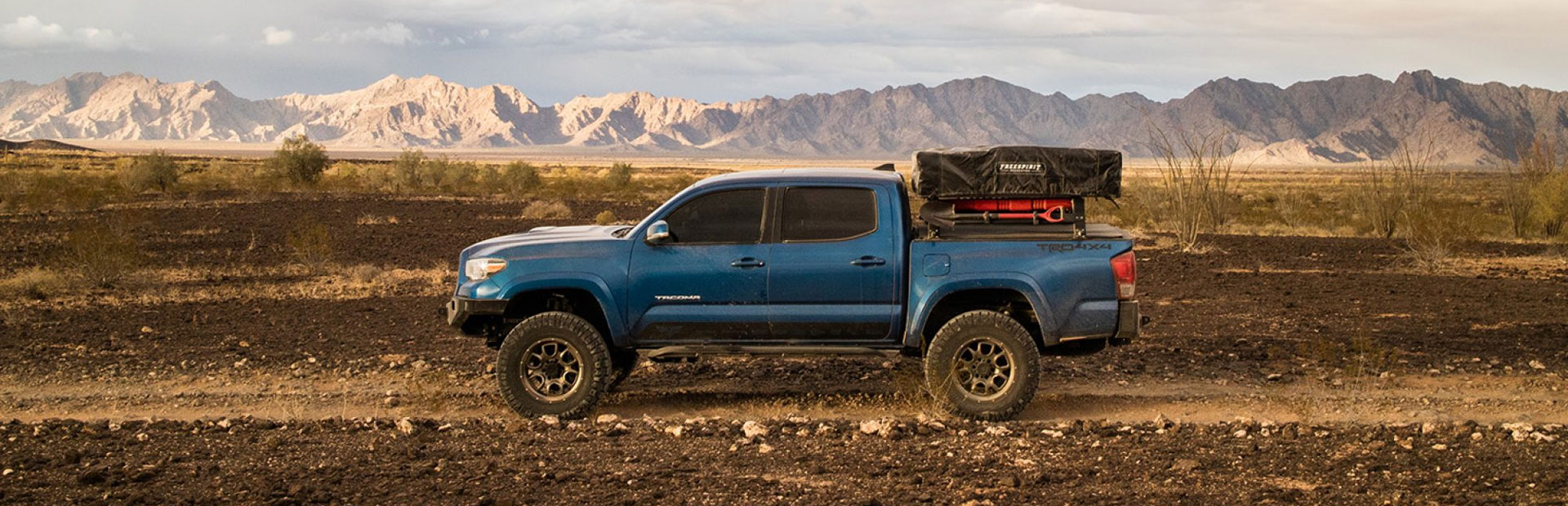 OFFROAD SHOP: SoCal SuperTrucks Shop in San Bernardino | Toyota Tacoma 4x4 Overland in offroading in the High Desert.